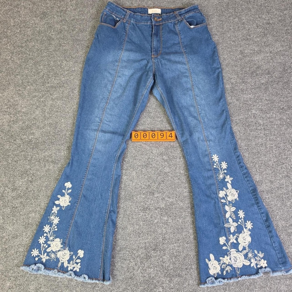 Chelsea & Violet blue flared denim jeans with white floral embroidery. No tag.